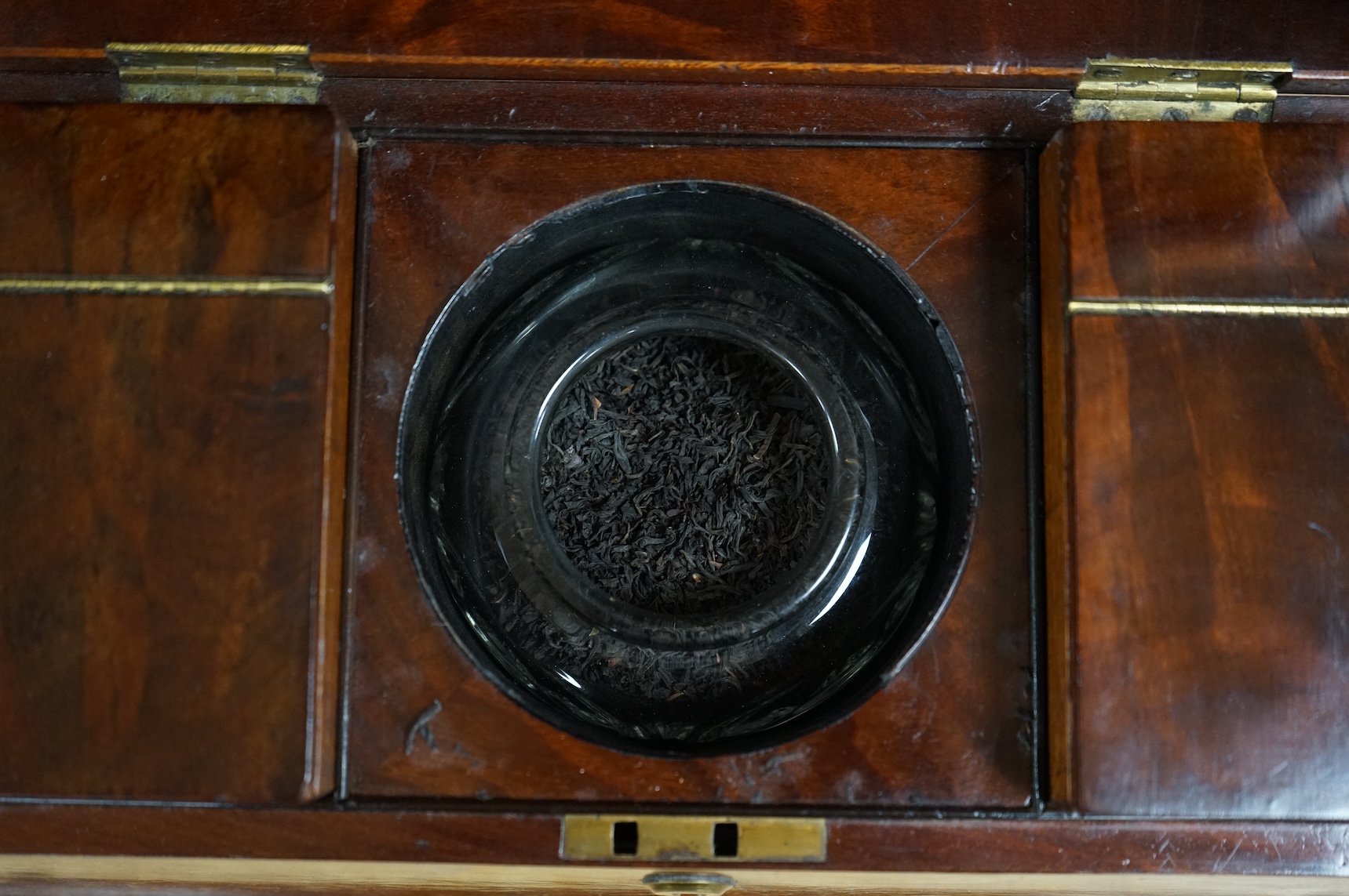 An early Victorian mahogany sarcophagus shaped tea caddy, 35cm wide